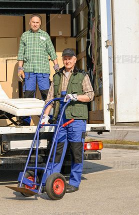 Mover two man loading furniture on truck