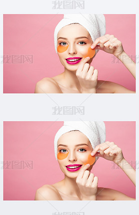 cheerful naked girl applying eye patches isolated on pink 