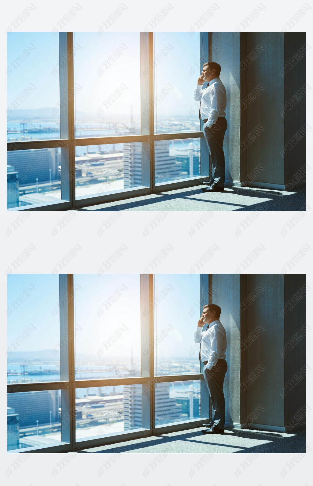 Mature and cnofident business executive looking looking out of large windows at a view of the city b