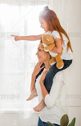 mother and daughter piggybacking