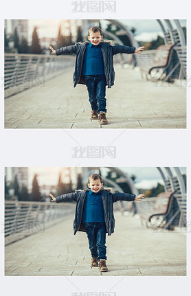 Little boy walking on bridge. 