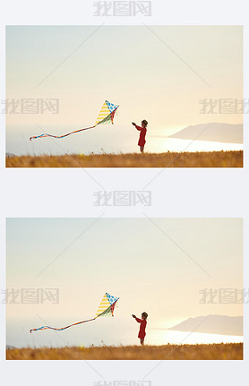 happy kid girl launches a kite at sunset outdoors