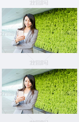 Businesswoman reading on cellphone