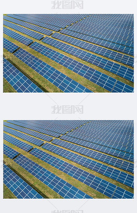 Aerial top view of a sun lit solar panels