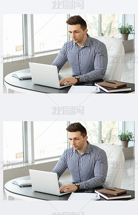 Handsome businesan working in office
