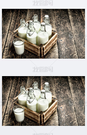 Bottles with fresh milk in a box.