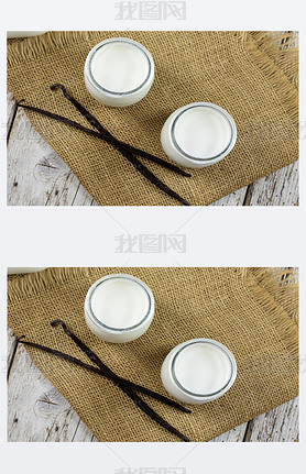 Yoghurt in glass jars on a cloth napkin.