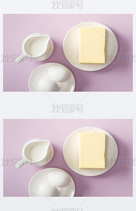 top view of butter, milk jug and boiled eggs on white plates on violet background