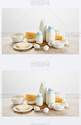 various fresh organic dairy products and eggs on wooden table isolated on white