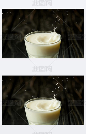 closeup view of splashing drops of milk from glass 