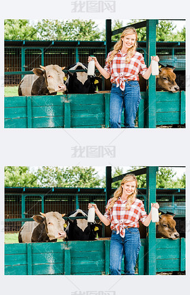 beautiful farmer showing bottles of cow milk near stable 