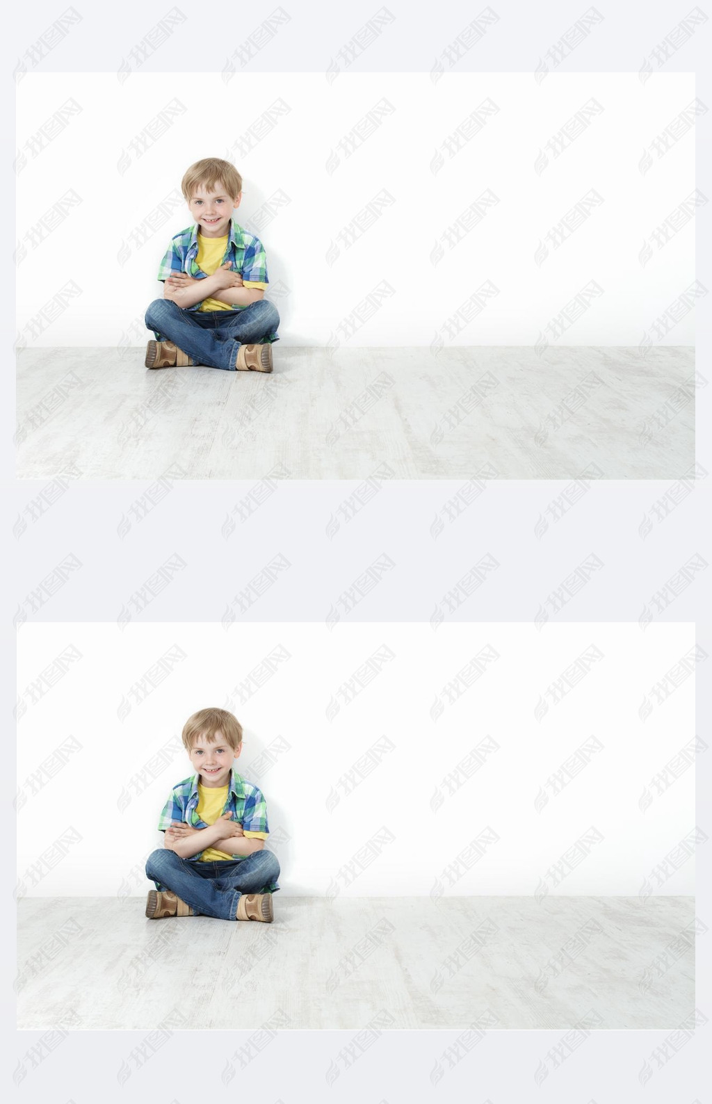 Handsome little boy sitting on floor leaning against white wall