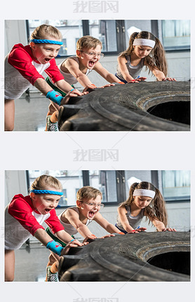 kids training with tire at fitness studio