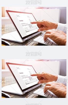 Close-up Of A Businessperson's Hand Analyzing Invoice On Laptop At Workplace