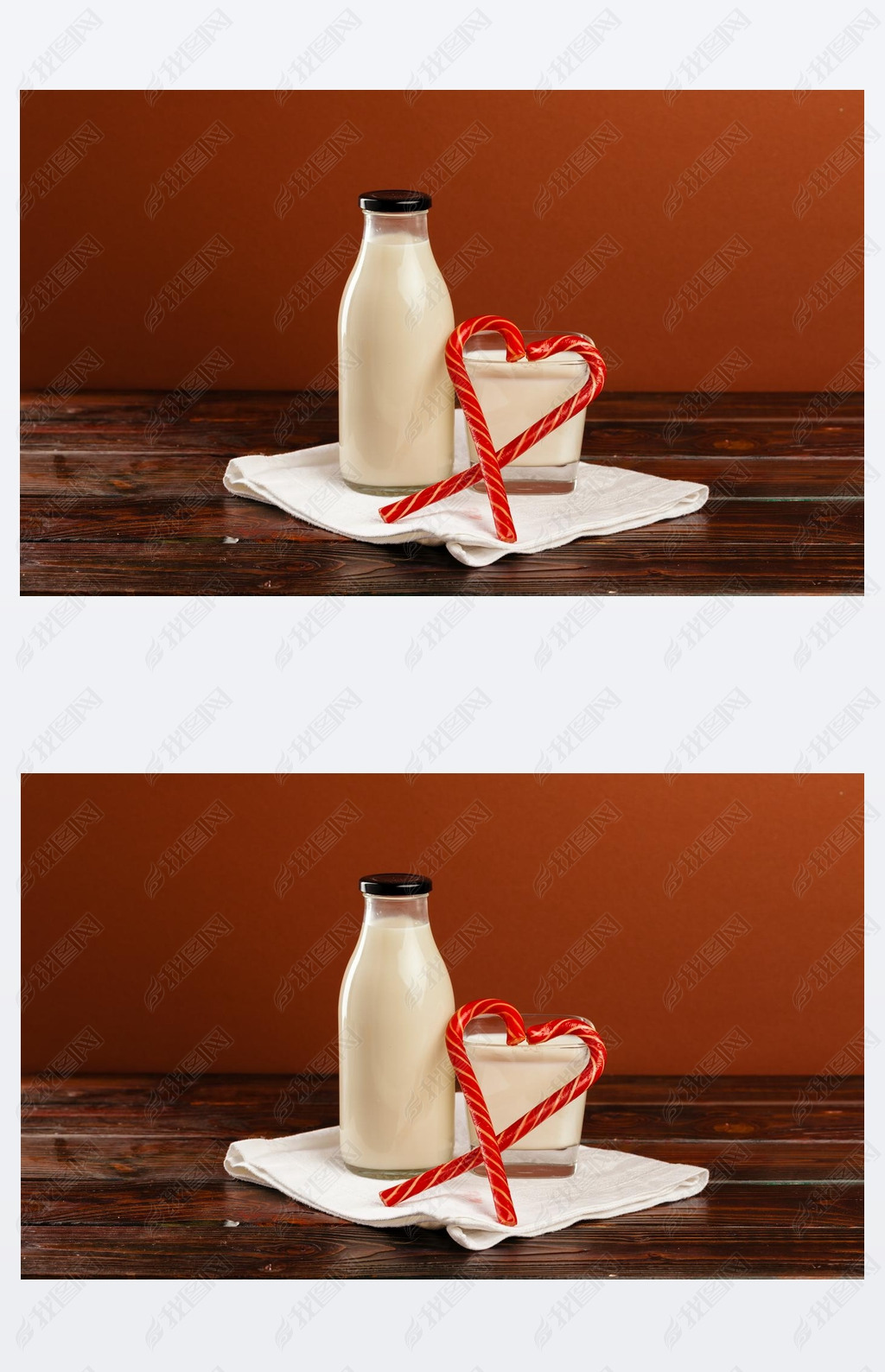 Glass bottle of fresh milk and candy canes on wooden table