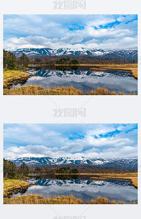 Beautiful lake reflecting blue sky like a mirror, rolling mountain range and woodland in the backgro