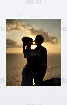 Silhouette of a young couple at sunset