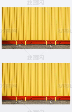 Detail of bright yellow metal building facade. For background