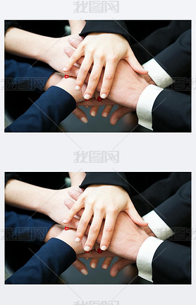 Closeup of pile of hands of business partners