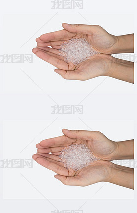 Close up of hand holding silica gel on white background, Desiccant attract moisture for chemical.