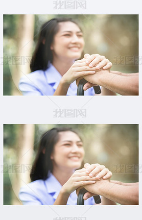 Comforting hand. Young nurse holding old man's hand in outdoor garden sitting on bench. Senior care,