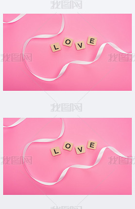 top view of curved ribbon and wooden blocks with love lettering isolated on pink