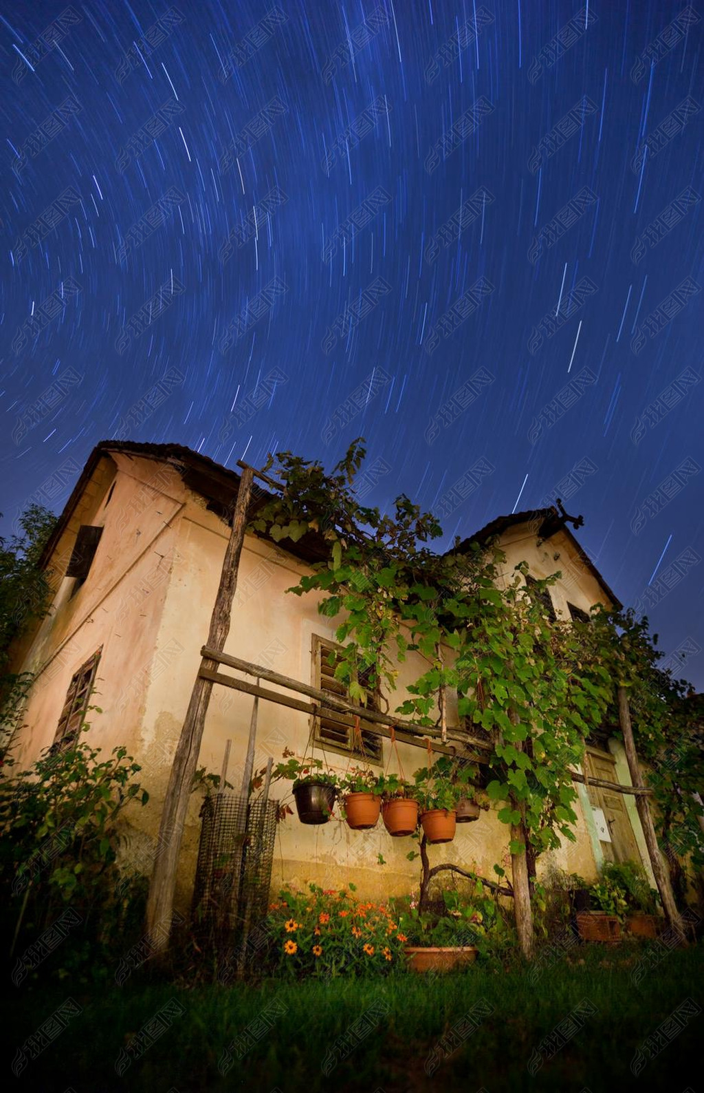 Old house with star trails