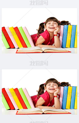 Happy little girl reading a book on the floor