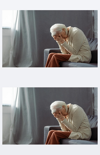 老太婆闷闷不乐地坐在沙发上,弯着腰,双手捂着脸