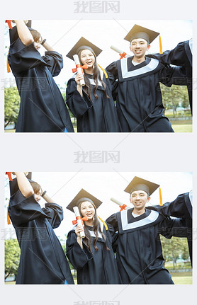 happy  students in graduation gowns holding diplomas on university campus