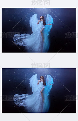 幻想中的女天使带着白色的大鸟翅膀在空中翱翔飘浮中的鬼女孩飞了漆黑