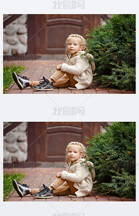 Adorable little curly blond girl in beige knitted sweater ilin
