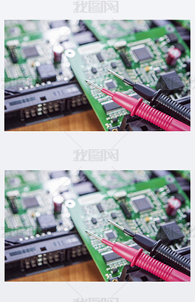 Laboratory Components and Staff. Pins of Digital Multimeter In Front of Printed Circuit  Boards with