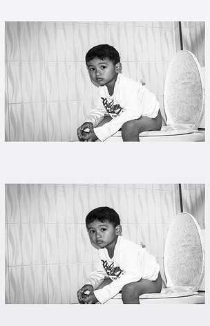 可爱的孩子小亚洲男孩大便在黑色和白色的厕所t