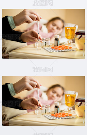 Macro shot of woman filling syringe from ampule