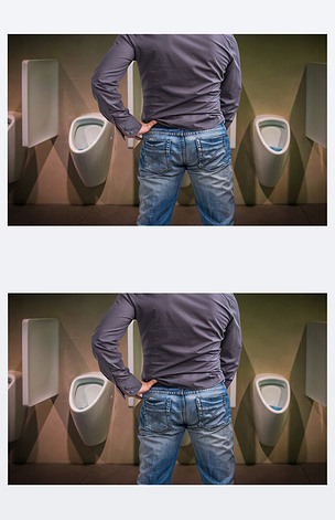 站到小便池在厕所里撒尿的人