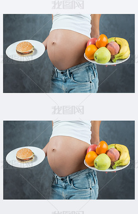 Close up of a cute pregnant belly tummy and healthy food. Pregna