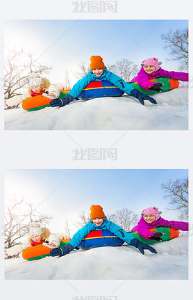 Group of children sliding on colorful tubes