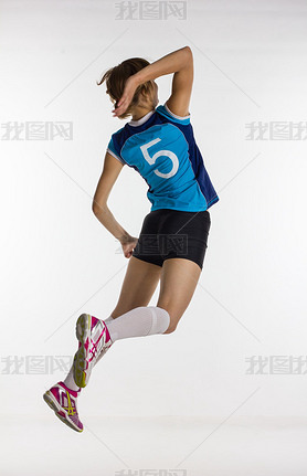 young athletic volleyball player returns the ball