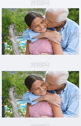 grandfather and his granddaughter hugging and kissing
