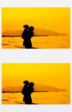 妈妈和宝宝亲吻日落的剪影