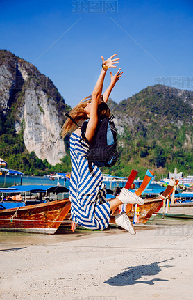 girl jumping in exotic tropical island