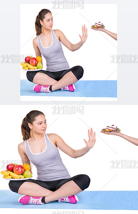 girl on a sports carpet chooses fruit instead of sweets