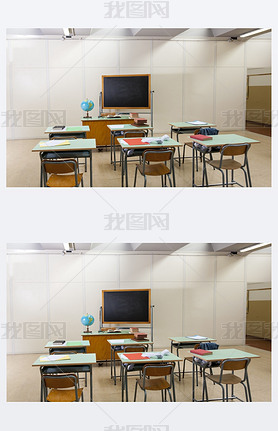 desks and blackboard in classroom at school