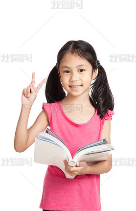 Happy little asian girl  read a book show victory sign