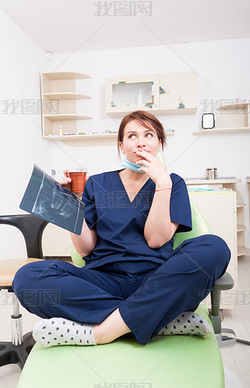 Dentist woman thinking in her coffee break