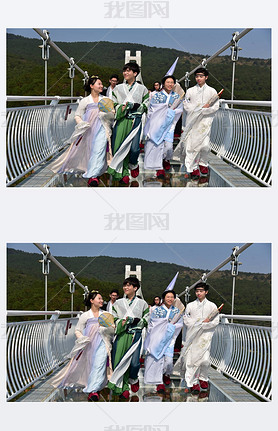 Models dressed in Hanfu or traditional Chinese costume pose on a glass-bottomed bridge in Foshan cit