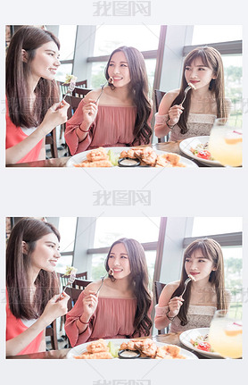 women hing dinner in restaurant