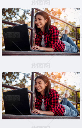 Young woman lying on step using laptop. College student is studying with laptop.