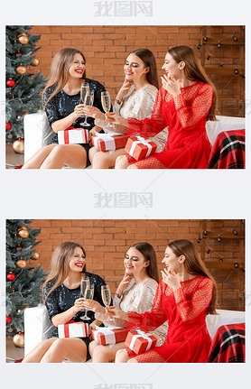 Beautiful young women with Christmas gifts and champagne at home